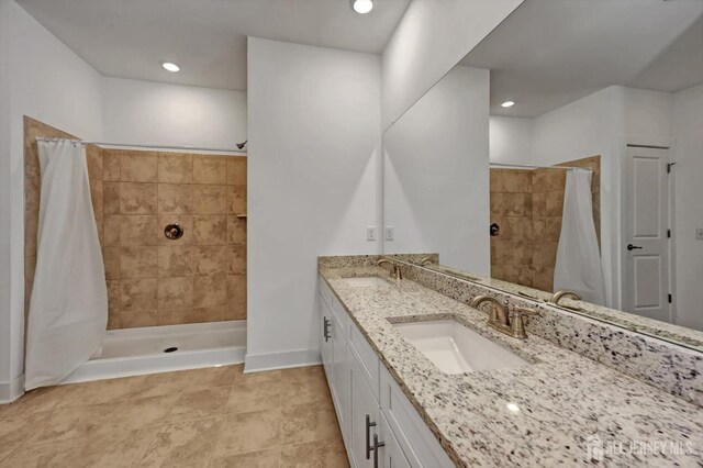 bathroom featuring a shower with curtain and vanity