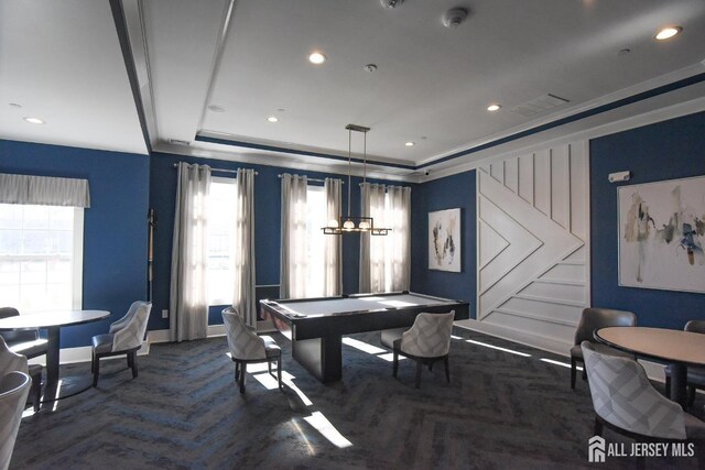 recreation room with dark parquet floors, a tray ceiling, and pool table