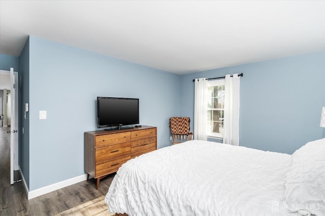 bedroom featuring dark hardwood / wood-style flooring