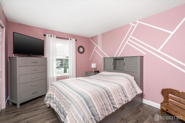 bedroom featuring dark wood-type flooring