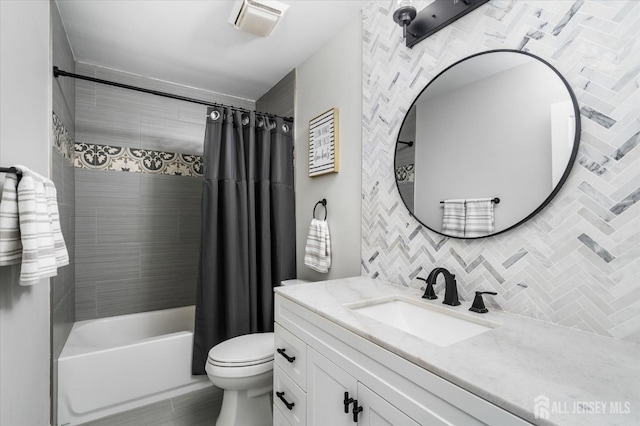 full bathroom featuring tasteful backsplash, vanity, toilet, and shower / bath combo