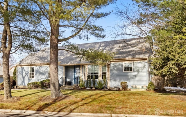 ranch-style house with a front lawn