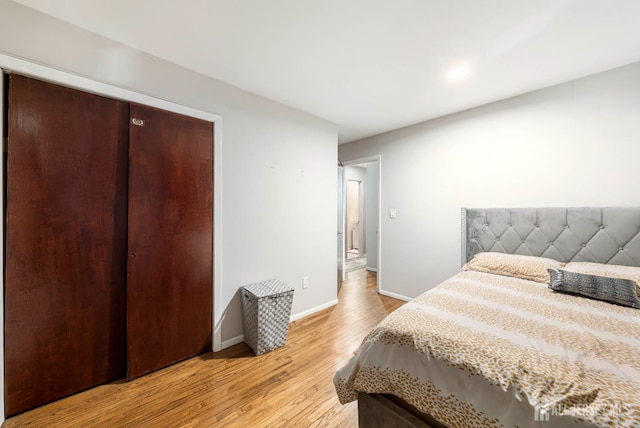 21 Coolidge Ave, East Brunswick, NJ 08816 - bedroom with baseboards, light wood-type flooring, and a closet