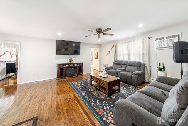 21 Coolidge Ave, East Brunswick, NJ 08816 - living area featuring a wall unit AC, wood finished floors, ceiling fan, recessed lighting, and baseboards