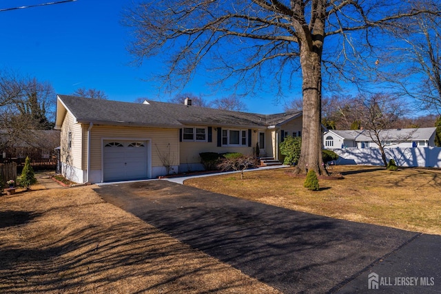 21 Coolidge Ave, East Brunswick, NJ 08816 - ranch-style house with an attached garage and driveway
