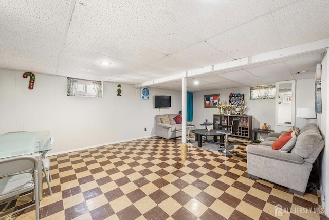 21 Coolidge Ave, East Brunswick, NJ 08816 - living area with tile patterned floors and a drop ceiling
