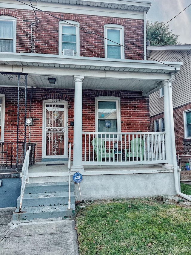 property entrance with covered porch