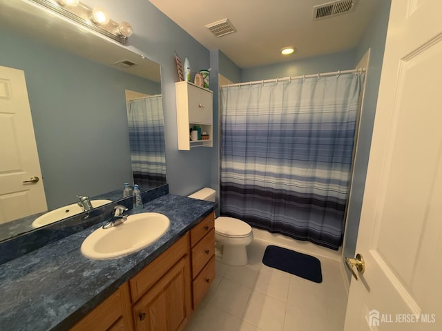 bathroom featuring vanity, tile patterned floors, toilet, and a shower with shower curtain