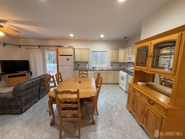 dining space with ceiling fan, plenty of natural light, recessed lighting, and light tile patterned flooring