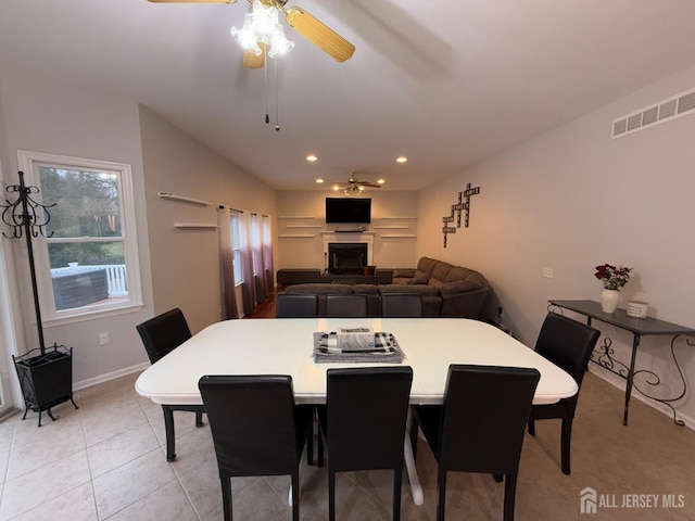 dining space with ceiling fan, recessed lighting, baseboards, and light tile patterned floors
