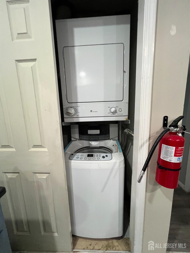 354 Burdock Ct, Readington, NJ 08887 - laundry room featuring stacked washer and clothes dryer
