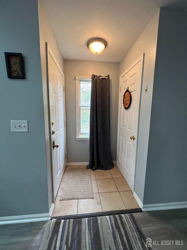 354 Burdock Ct, Readington, NJ 08887 - entryway with baseboards and light tile patterned floors