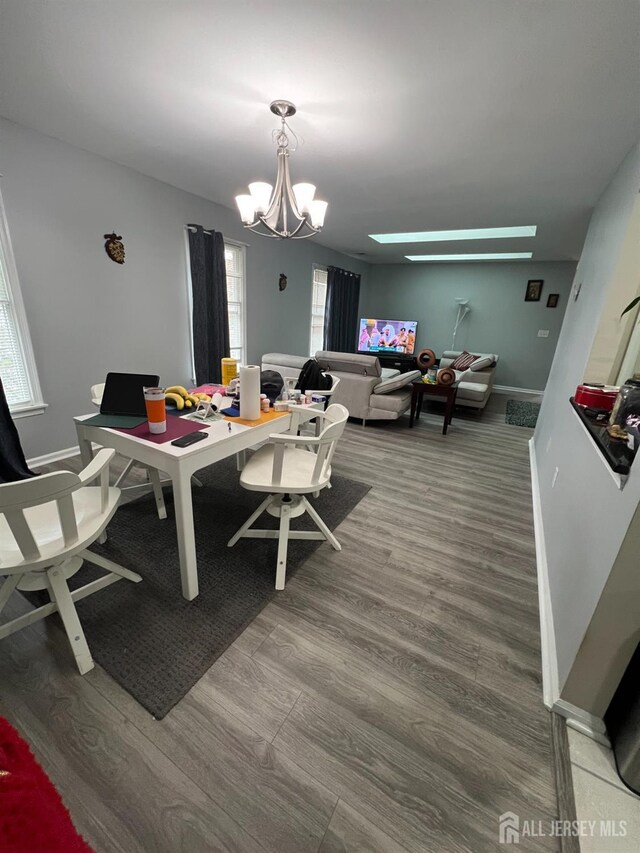 354 Burdock Ct, Readington, NJ 08887 - dining room with a chandelier, wood finished floors, a desk, and baseboards