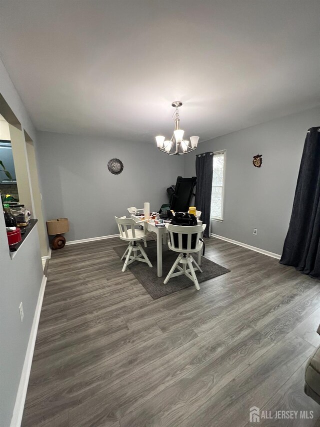 354 Burdock Ct, Readington, NJ 08887 - dining space with an office area, a chandelier, wood finished floors, and baseboards