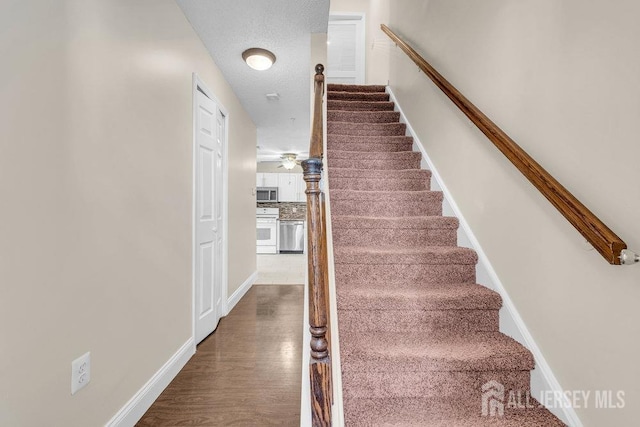 46 Prestwick Way, Edison, NJ 08820 - staircase featuring wood finished floors and baseboards