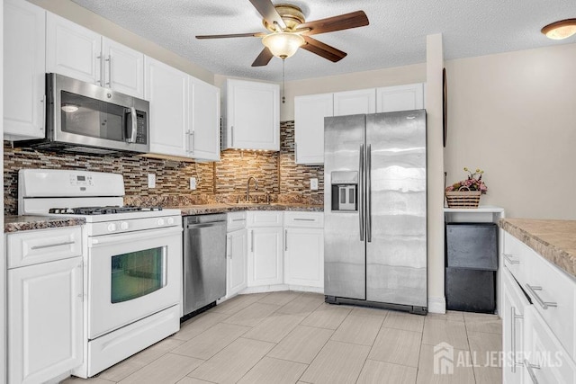 46 Prestwick Way, Edison, NJ 08820 - kitchen with appliances with stainless steel finishes, a ceiling fan, white cabinetry, tasteful backsplash, and a sink