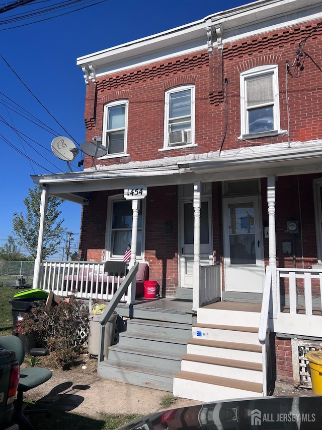 townhome / multi-family property with covered porch