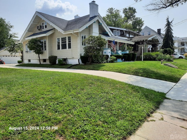 view of side of property with a garage and a yard