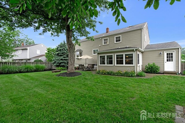 117 Osceola Ave, Middlesex, NJ 08846 - rear view of property featuring a patio, a chimney, and roof with shingles