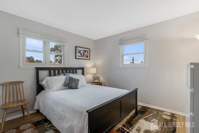 117 Osceola Ave, Middlesex, NJ 08846 - bedroom with baseboards and dark wood-style floors