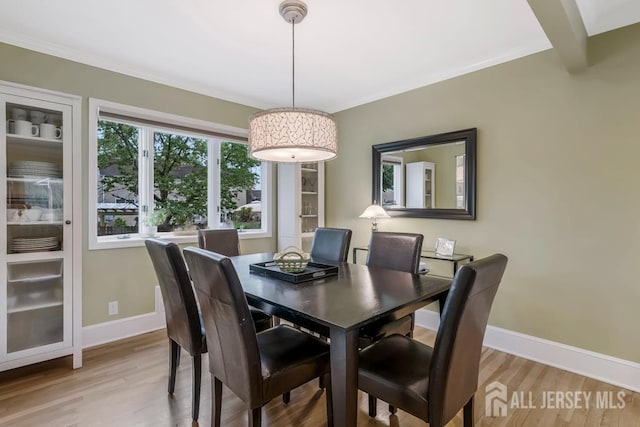 117 Osceola Ave, Middlesex, NJ 08846 - dining room with light wood-type flooring and ornamental molding