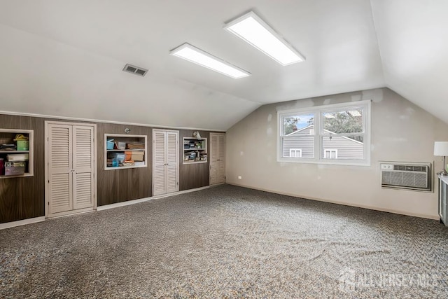 117 Osceola Ave, Middlesex, NJ 08846 - additional living space with vaulted ceiling, carpet floors, and an AC wall unit