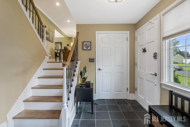 117 Osceola Ave, Middlesex, NJ 08846 - entryway featuring recessed lighting, stairs, and dark tile patterned floors