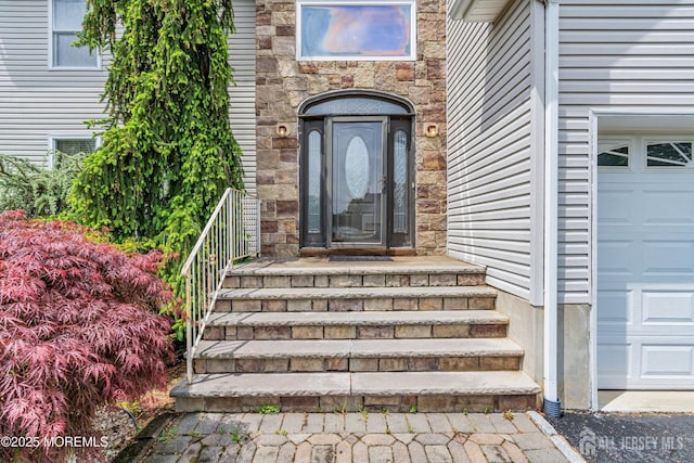 11 Patio Ct, Monroe, NJ 08831 - property entrance featuring a garage and stone siding