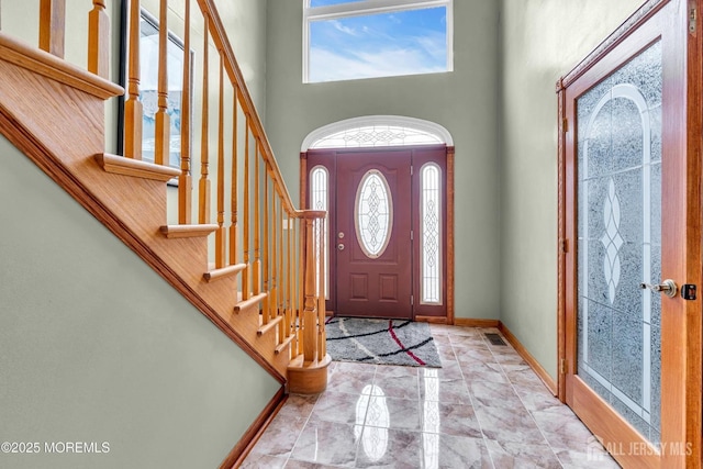 11 Patio Ct, Monroe, NJ 08831 - foyer featuring a high ceiling, stairway, baseboards, and marble finish floors