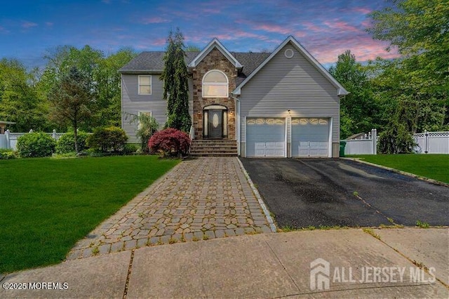 11 Patio Ct, Monroe, NJ 08831 - traditional-style house featuring driveway, stone siding, and a garage