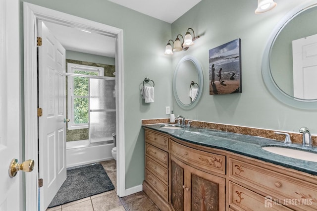 6 Highland Ave, Piscataway, NJ 08854 - full bathroom featuring toilet, double vanity, shower / bath combination with glass door, and tile patterned flooring