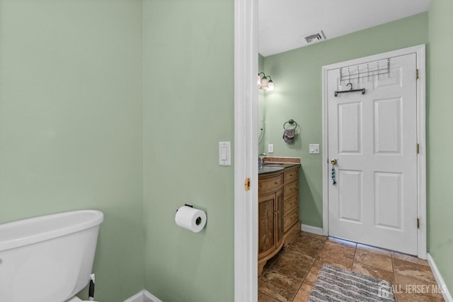 6 Highland Ave, Piscataway, NJ 08854 - bathroom with vanity, baseboards, toilet, and stone finish floors