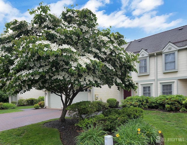 52 Fair Acres Ct, South Brunswick, NJ 08540 - view of front of house with a garage, a front lawn, and driveway