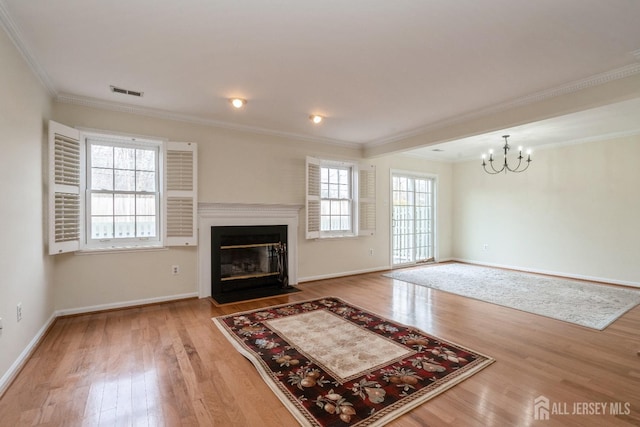 52 Fair Acres Ct, South Brunswick, NJ 08540 - unfurnished living room with a chandelier, wood finished floors, crown molding, and a fireplace with flush hearth