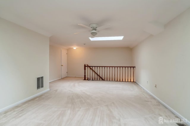 52 Fair Acres Ct, South Brunswick, NJ 08540 - unfurnished room with a skylight, a ceiling fan, and light carpet