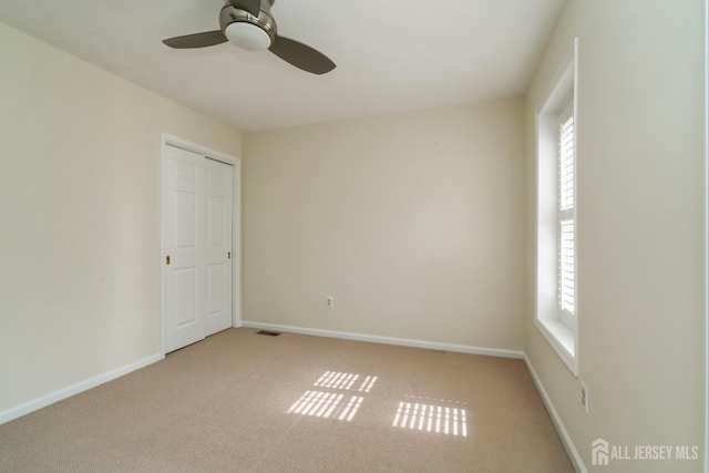 52 Fair Acres Ct, South Brunswick, NJ 08540 - empty room featuring healthy amount of natural light, ceiling fan, and light colored carpet