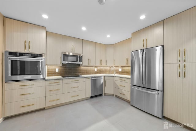 15 Betsy Ross Dr Unit B, Monroe, NJ 08831 - kitchen featuring stainless steel appliances, light brown cabinets, decorative backsplash, recessed lighting, and light stone counters