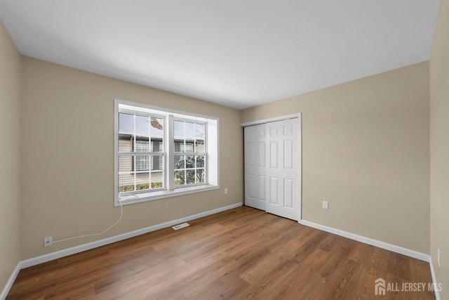 15 Betsy Ross Dr Unit B, Monroe, NJ 08831 - unfurnished bedroom with wood finished floors and a closet