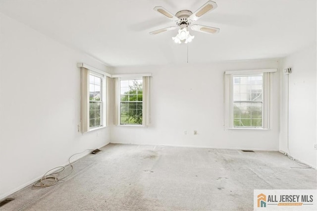 57 Yorkshire Dr Unit 57B, Jamesburg, NJ 08831 - carpeted empty room featuring plenty of natural light and a ceiling fan