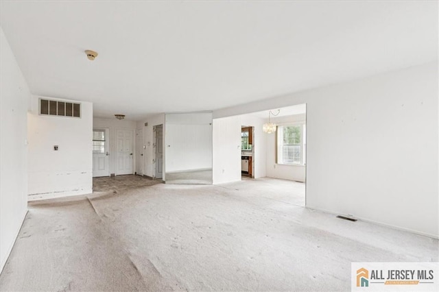 57 Yorkshire Dr Unit 57B, Jamesburg, NJ 08831 - unfurnished room with light carpet and a chandelier