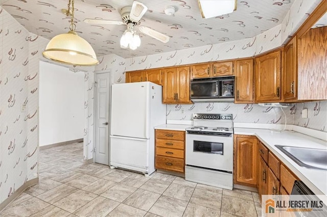 57 Yorkshire Dr Unit 57B, Jamesburg, NJ 08831 - kitchen featuring wallpapered walls, white appliances, brown cabinetry, light countertops, and ceiling fan