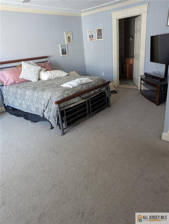 41 Village Rd, Sea Bright, NJ 07760 - bedroom featuring crown molding, carpet flooring, baseboards, and connected bathroom