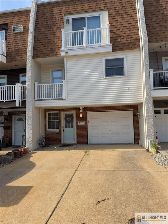 41 Village Rd, Sea Bright, NJ 07760 - view of front facade with driveway, a shingled roof, and mansard roof