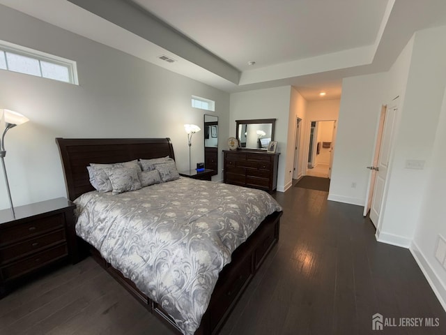 43 Starlight Dr, Monroe, NJ 08831 - bedroom featuring dark wood-style flooring, a tray ceiling, and baseboards