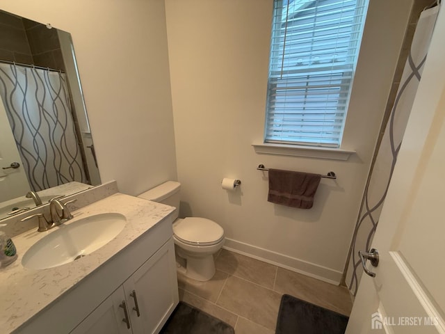 full bath with curtained shower, baseboards, toilet, tile patterned floors, and vanity