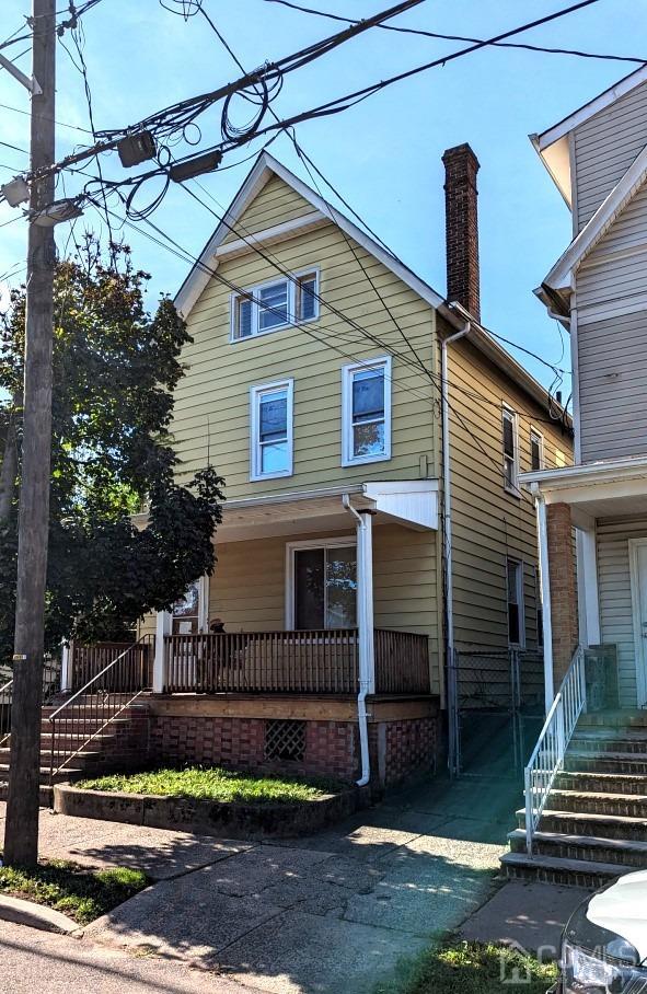 view of property with covered porch