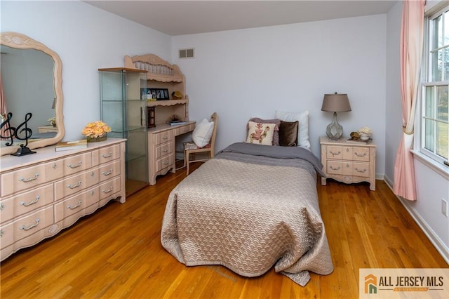 bedroom featuring light hardwood / wood-style floors