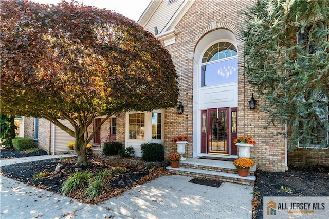 property entrance with brick siding