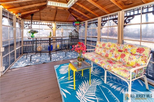 unfurnished sunroom with lofted ceiling and wooden ceiling