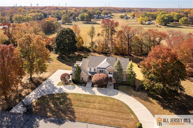 birds eye view of property with a rural view